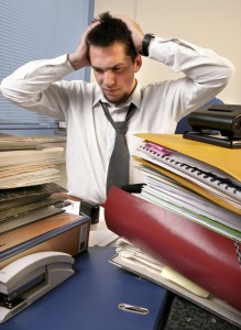 young, white callar worker on his job training overloaded with work